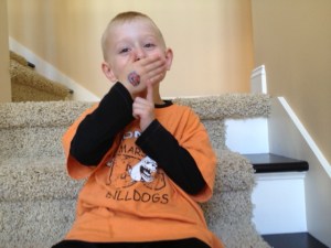 Cooper showing off his school colors and bulldog tattoo